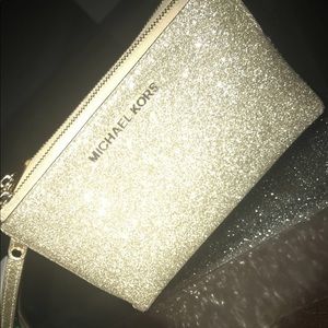 Michael kors glittery 2 sided wristlet wallet.